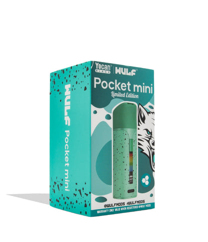 A boxed product on a clean white background. The package is a turquoise and teal retail box for the WULF Pocket mini limited edition, featuring a printed photo of a mint green speckled pocket device and a wolf illustration.